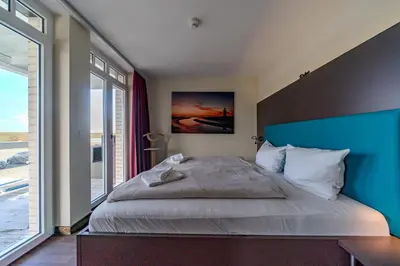 Ein Bett oder Betten in einem Zimmer der Unterkunft Resort Deichgraf Resort Deichgraf 27-08