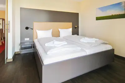 Ein Bett oder Betten in einem Zimmer der Unterkunft Resort Deichgraf Resort Deichgraf 27-15