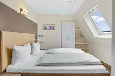 Ein Bett oder Betten in einem Zimmer der Unterkunft Resort Deichgraf Resort Deichgraf 27-18