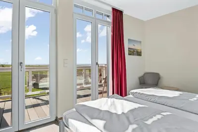 Ein Bett oder Betten in einem Zimmer der Unterkunft Resort Deichgraf Resort Deichgraf 27-19