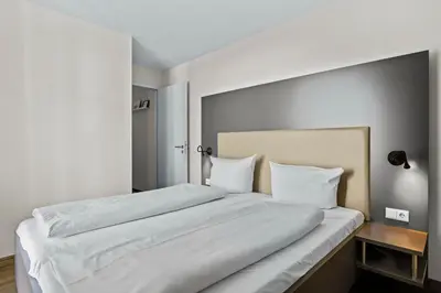 Ein Bett oder Betten in einem Zimmer der Unterkunft Resort Deichgraf Resort Deichgraf 31-06