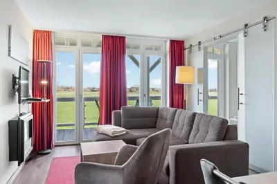 Ein Sitzbereich in der Unterkunft Resort Deichgraf Resort Deichgraf 31-08