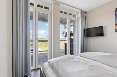 Ein Bett oder Betten in einem Zimmer der Unterkunft Resort Deichgraf Resort Deichgraf 31-11