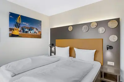 Ein Bett oder Betten in einem Zimmer der Unterkunft Resort Deichgraf Resort Deichgraf 31-11