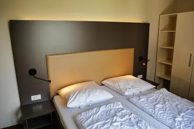 Ein Bett oder Betten in einem Zimmer der Unterkunft Resort Deichgraf Resort Deichgraf 31-12