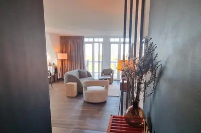 Ein Sitzbereich in der Unterkunft Resort Deichgraf Resort Deichgraf 31-18