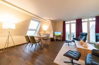 Ein Sitzbereich in der Unterkunft Resort Deichgraf Resort Deichgraf 31-20