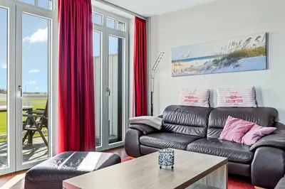 Ein Sitzbereich in der Unterkunft Resort Deichgraf Resort Deichgraf 27-21