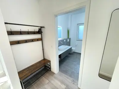 Ein Badezimmer in der Unterkunft Lee-Moderne Neubauwohnung in Strandnähe - Wallbox