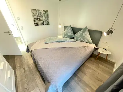 Ein Bett oder Betten in einem Zimmer der Unterkunft Luv-Moderne Neubauwohnung in Strandnähe-Wallbox