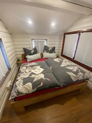 Ein Bett oder Betten in einem Zimmer der Unterkunft Ferienhaus“Wieden am See“