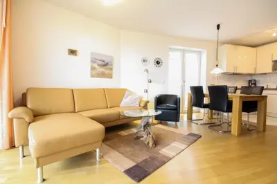 Ein Sitzbereich in der Unterkunft Strandpalais, Whg 05
