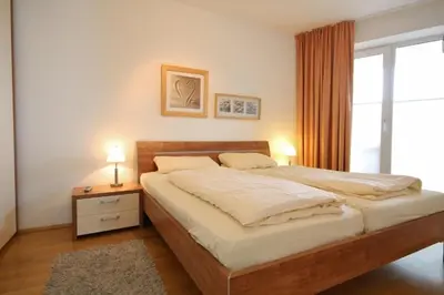 Ein Bett oder Betten in einem Zimmer der Unterkunft Strandpalais, Whg 05