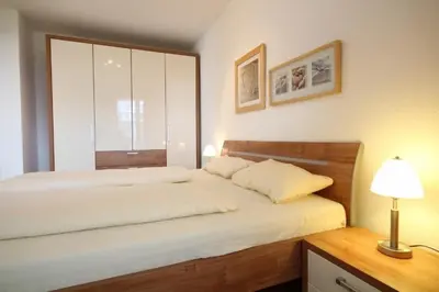 Ein Bett oder Betten in einem Zimmer der Unterkunft Strandpalais, Whg 05