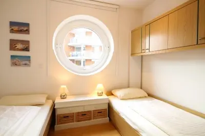 Ein Bett oder Betten in einem Zimmer der Unterkunft Strandpalais, Whg 05