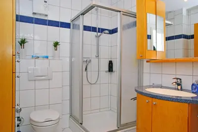 Ein Badezimmer in der Unterkunft Haus Weisse Möwe, Whg 1