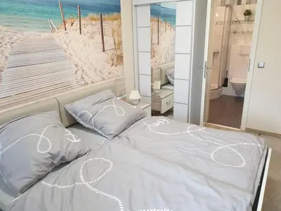 Ein Bett oder Betten in einem Zimmer der Unterkunft Strandstraße 51a, FeWo Marina