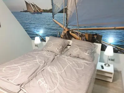 Ein Bett oder Betten in einem Zimmer der Unterkunft Strandstraße 51a, FeWo Piratennest