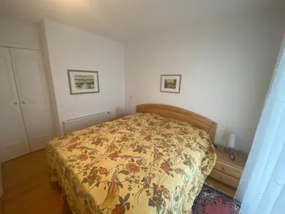 Ein Bett oder Betten in einem Zimmer der Unterkunft Dünenwind, Ferienwohnung 4