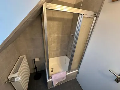 Ein Badezimmer in der Unterkunft Haus Seefalke - 250 m zum Meer