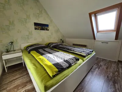 Ein Bett oder Betten in einem Zimmer der Unterkunft Ferienhaus Butendieksweg 99a