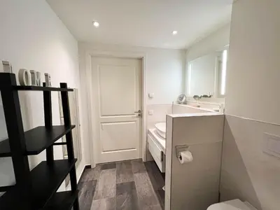 Ein Badezimmer in der Unterkunft Haus Strandläufer Apartment 3 5 Strandgut