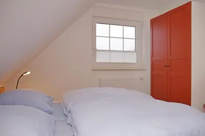 Ein Bett oder Betten in einem Zimmer der Unterkunft Haus Felix, Whg 7
