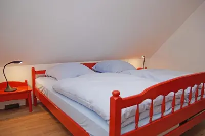 Ein Bett oder Betten in einem Zimmer der Unterkunft Haus Felix, Whg 7