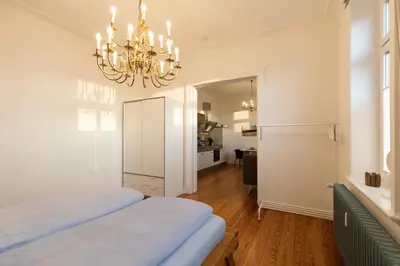 Ein Bett oder Betten in einem Zimmer der Unterkunft Haus Kapitäns Villa, Backkajüte