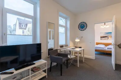 Ein Bett oder Betten in einem Zimmer der Unterkunft Haus Kapitäns Villa, Bugkajüte