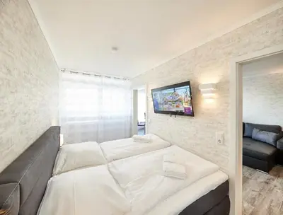 Ein Bett oder Betten in einem Zimmer der Unterkunft Frische Brise - 211