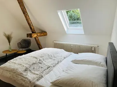 Ein Bett oder Betten in einem Zimmer der Unterkunft Deich Quartier 9.2