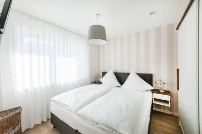 Ein Bett oder Betten in einem Zimmer der Unterkunft Haus Deichkieker Apartment 3 3 Wattläufer
