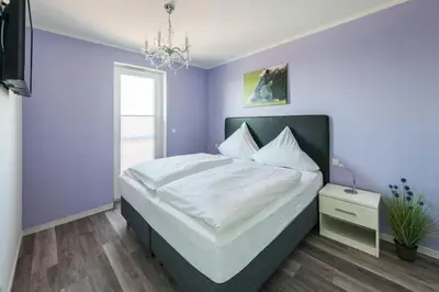 Ein Bett oder Betten in einem Zimmer der Unterkunft Haus Deichkieker Apartment 4 2 Watt n Meer