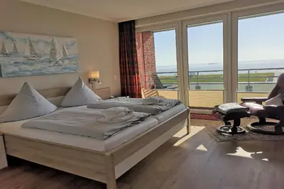 Ein Bett oder Betten in einem Zimmer der Unterkunft Haus Seewärts Wohnen Apartment 3 1