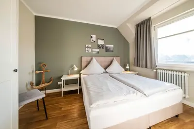 Ein Bett oder Betten in einem Zimmer der Unterkunft Haus Am Anker Wohnung 8