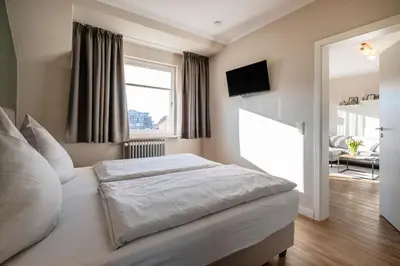 Ein Bett oder Betten in einem Zimmer der Unterkunft Haus Am Anker Wohnung 8