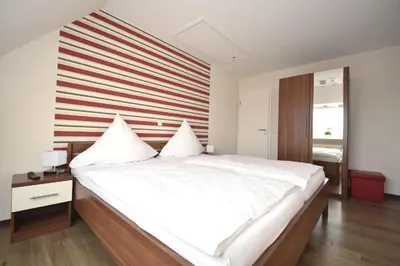 Ein Bett oder Betten in einem Zimmer der Unterkunft Haus Seemeile Wohnung 3 8