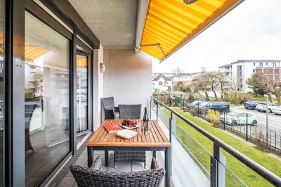 Ein Balkon oder eine Terrasse in der Unterkunft Haus Strandläufer Apartment 1 3 Büsumer Sprotte