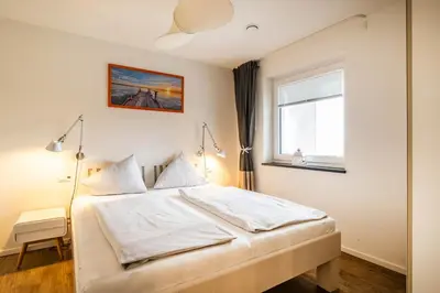 Ein Bett oder Betten in einem Zimmer der Unterkunft Haus Strandläufer Apartment 3 3 Strandhaus 3 3