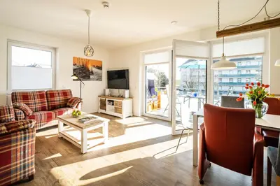 Ein Sitzbereich in der Unterkunft Haus Strandläufer Apartment 1 6 DeichLounge
