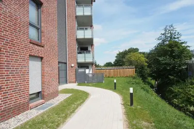 Ein Garten an der Unterkunft Haus Strandläufer Apartment 0 3 Mirelle