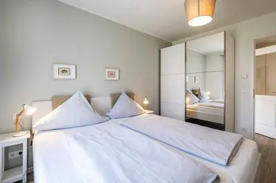 Ein Bett oder Betten in einem Zimmer der Unterkunft Haus Strandläufer Apartment 0 6