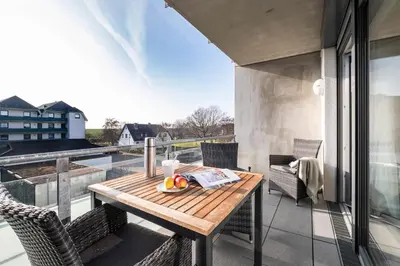 Ein Balkon oder eine Terrasse in der Unterkunft Haus Strandläufer Apartment 2 2 Küstennebel