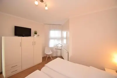 Ein Bett oder Betten in einem Zimmer der Unterkunft Haus Ankerplatz Apartment 2 2