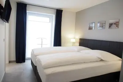 Ein Bett oder Betten in einem Zimmer der Unterkunft Haus Strandläufer Apartment 0 1 Strandburg