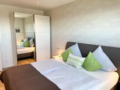 Ein Bett oder Betten in einem Zimmer der Unterkunft Haus Strandläufer Apartment 4 4 NordseeLounge