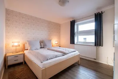 Ein Bett oder Betten in einem Zimmer der Unterkunft Haus Ankerplatz Apartment 2 5