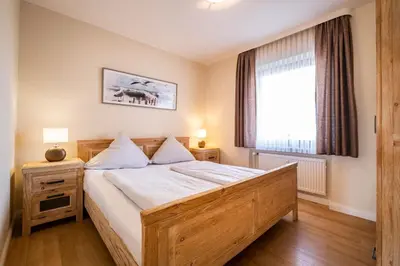 Ein Bett oder Betten in einem Zimmer der Unterkunft Haus Nordseeblick Wohnung 4