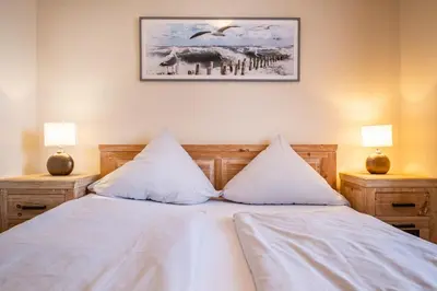 Ein Bett oder Betten in einem Zimmer der Unterkunft Haus Nordseeblick Wohnung 4